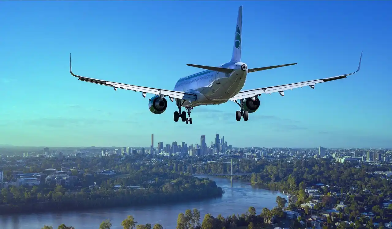 aeroplane in urban blue sky